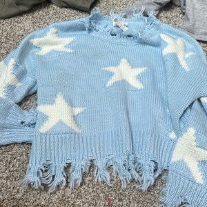 light blue and white stars frayed hem sweater